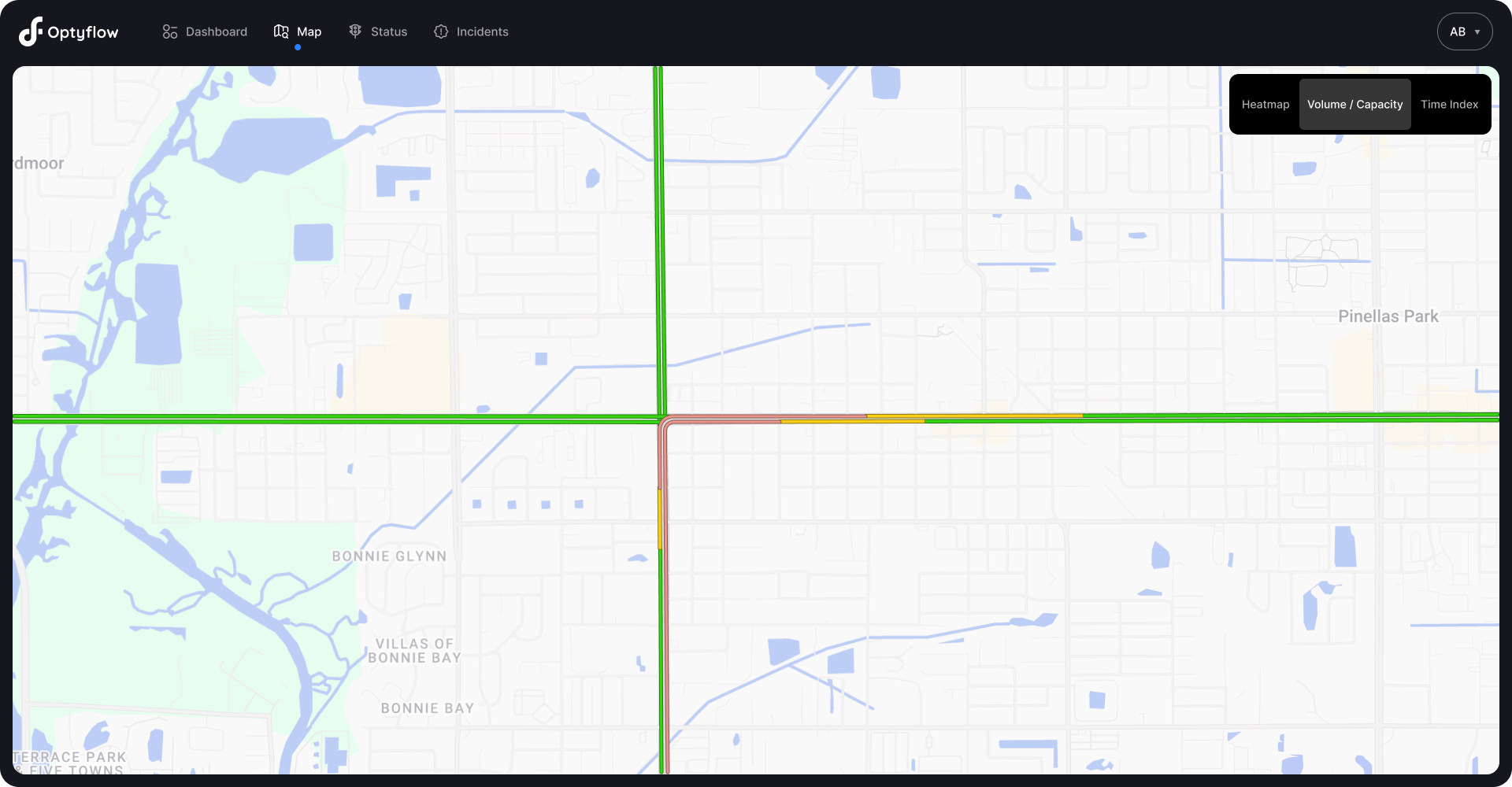 Traffic monitoring map displaying an intersection with colored road segments indicating traffic conditions, where green represents smooth flow and yellow or red indicate slower or congested traffic.
